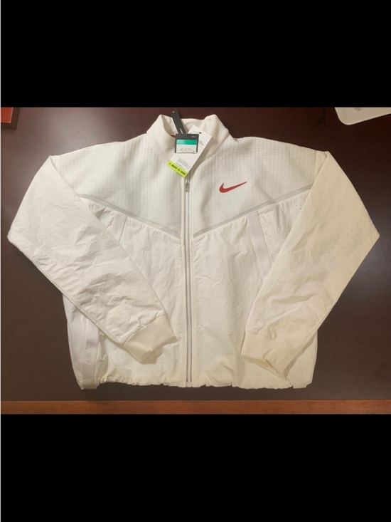 Nike Jackets & Blazers - Nike Sportswear "Move to Zero" Women’s Jacket in white with a red swoosh.
